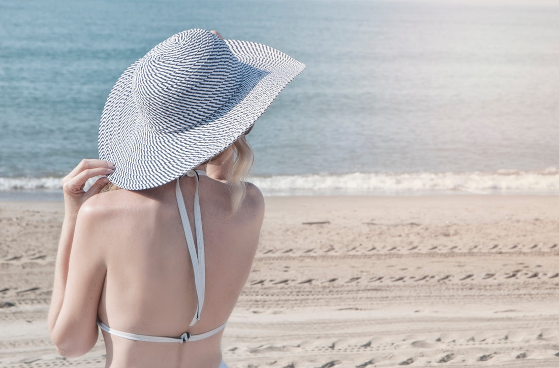 woman wearing grey sun hat during daytime