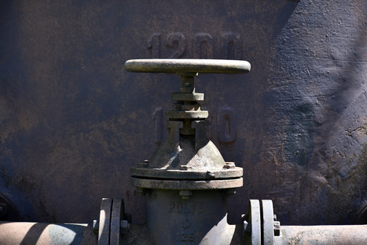 Close-up of an old industrial valve with date 1901.