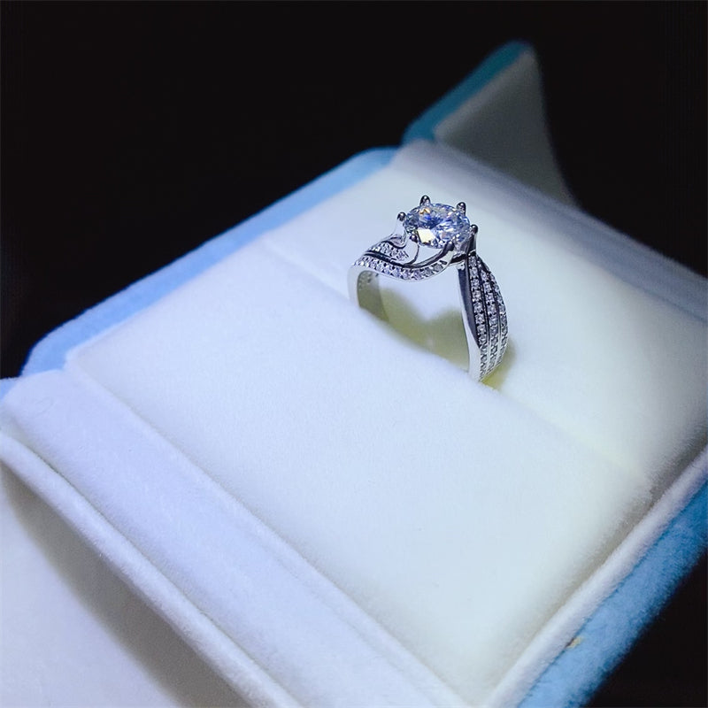 1 carat moissanite ring in 925 sterling silver, displayed in a jewelry box, showcasing its elegance and craftsmanship.