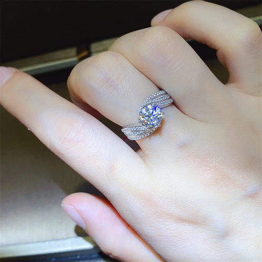 Elegant 1 Carat Moissanite ring on hand, set in 925 sterling silver with intricate band design.