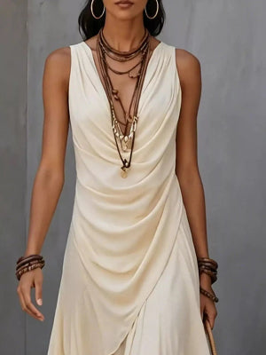Black flowy women's dress styled for a modern casual look