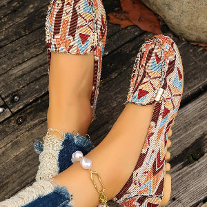 Casual patterned loafers worn with cropped jeans
