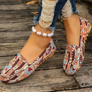 Patterned women's loafers styled with cropped denim jeans