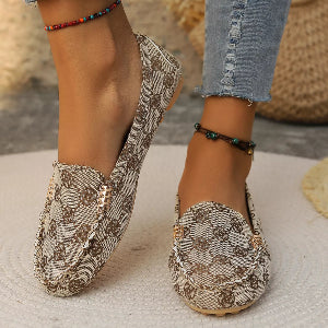 Women's patterned loafers styled with cropped jeans