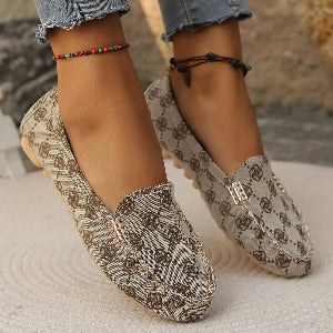 Women's printed loafers paired with cropped jeans