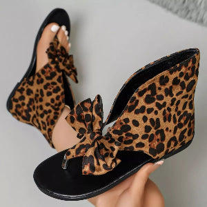 Women's printed loafers worn with cropped blue jeans