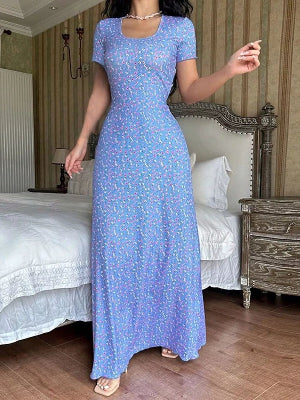 Women's long yellow floral dress with short sleeves and a fitted bodice