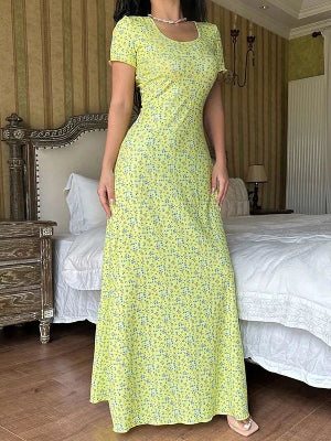 Elegant yellow floral women's dress with a fitted bodice and flowing skirt