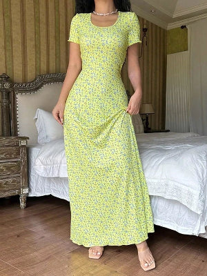 Yellow floral women's maxi dress with short sleeves and flowing long skirt